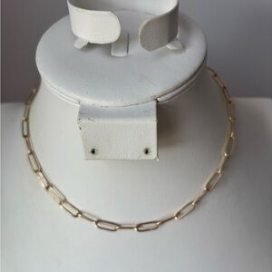 Paper clip style necklace in gold tone/ measures 14 + 2 in length/ lobster clasp